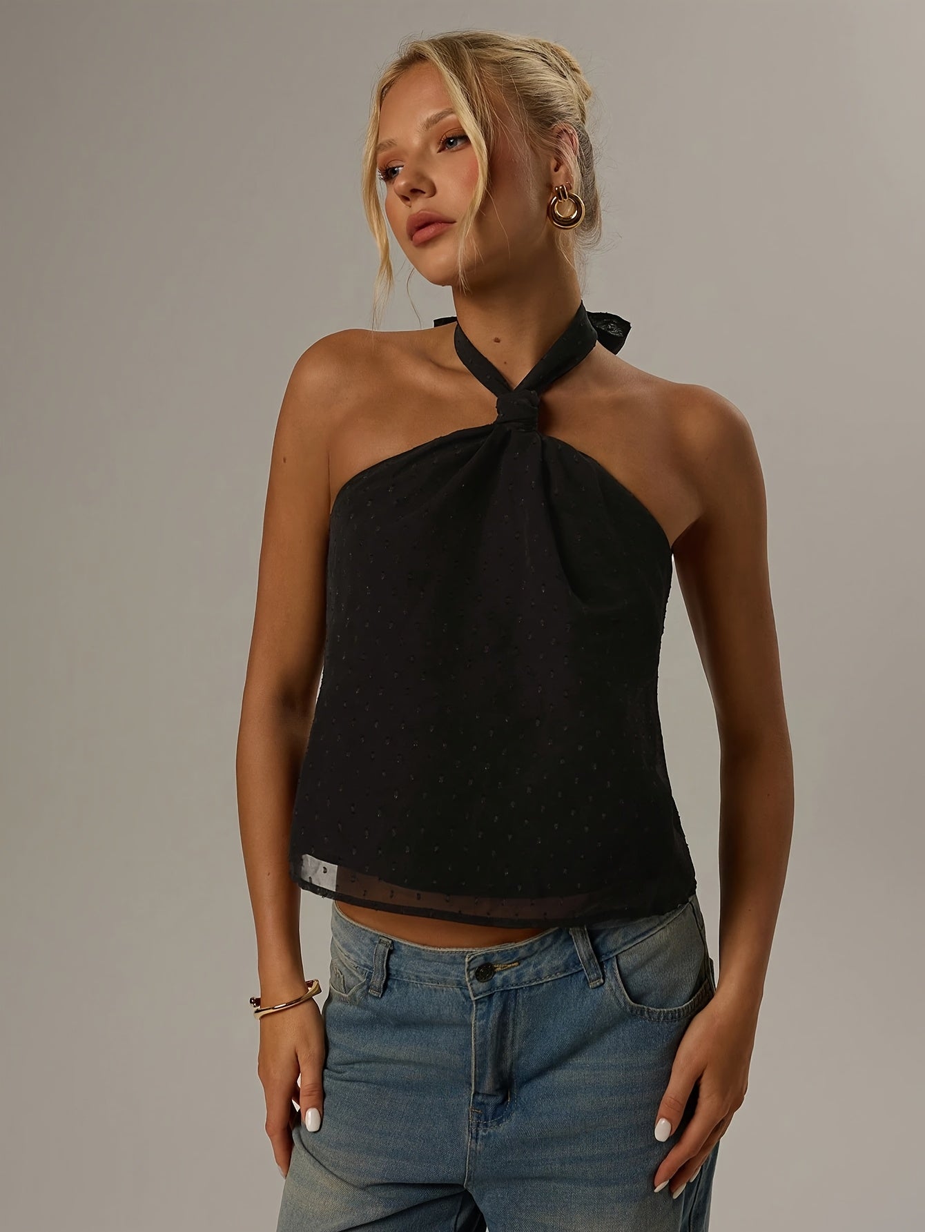 Elegant Black Swiss Dot Halter Top for Women with Twist Neck Open Back Cropped Flowing Style