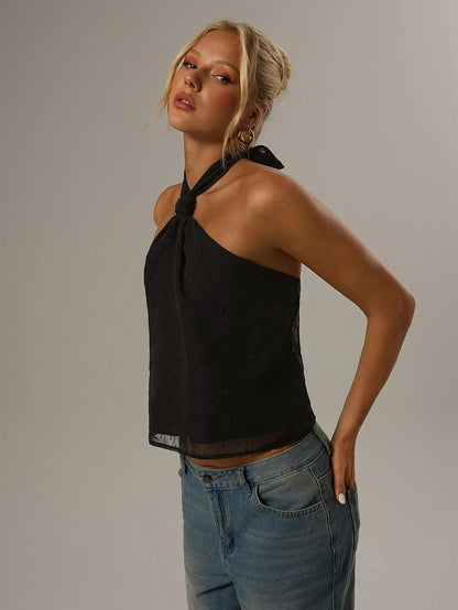 Elegant Black Swiss Dot Halter Top for Women with Twist Neck Open Back Cropped Flowing Style