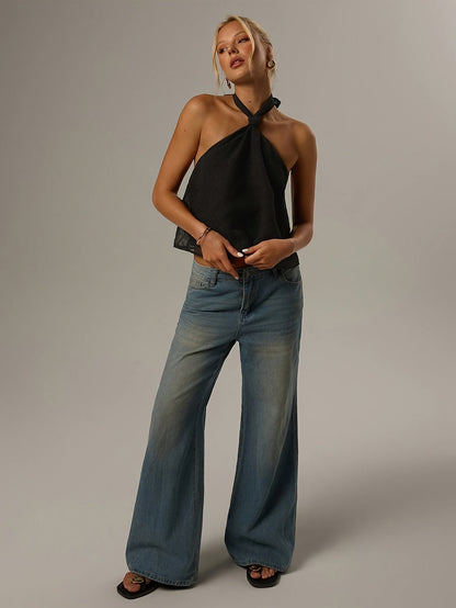 Elegant Black Swiss Dot Halter Top for Women with Twist Neck Open Back Cropped Flowing Style